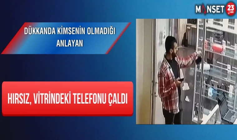 Dükkanda Kimsenin Olmadığı Anlayan Hırsız, Vitrindeki Telefonu Çaldı